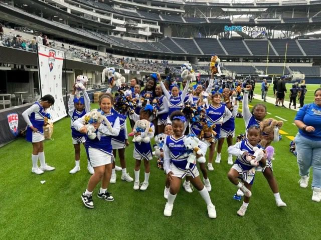 Cheerleaders celebrating with stuffed animals