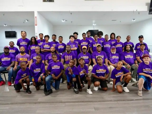 Group in purple shirts posing together
