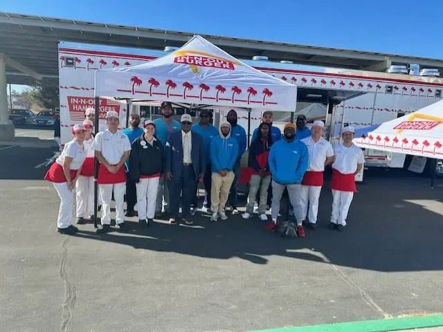 Team posing in front of food truck