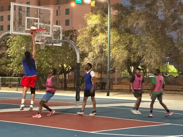 Players on outdoor basketball court