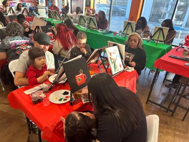 Children and adults painting together